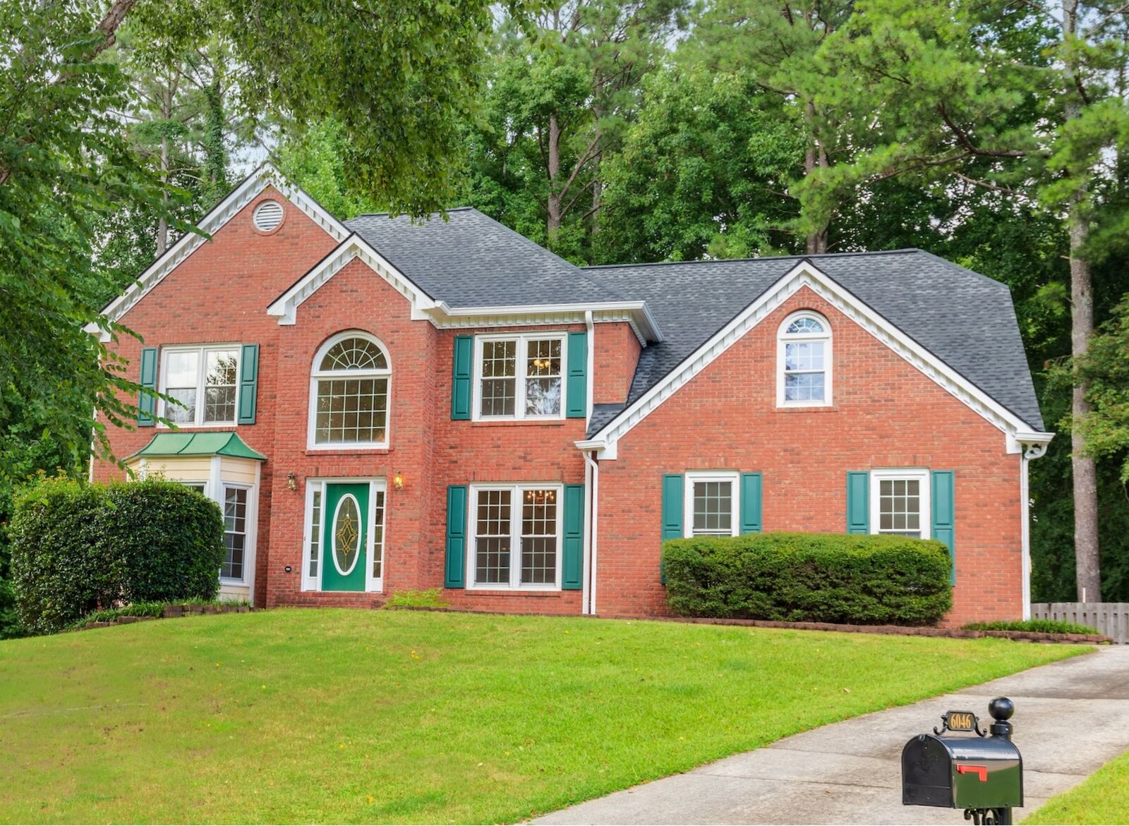 Brick traditional home at 6046 Braidwood Close
